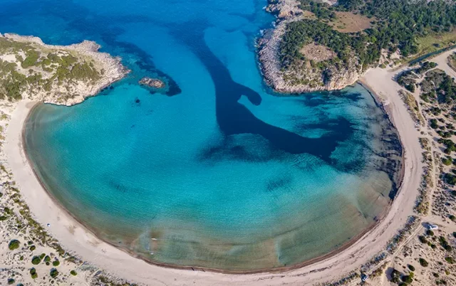 aerial photo of voidokilia beach- omega beach